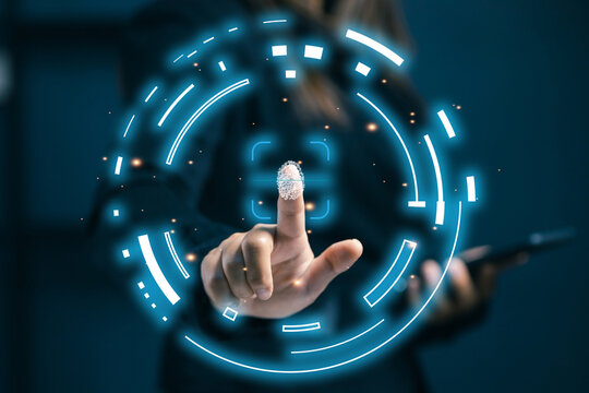 A businesswoman uses fingerprint authentication on a digital interface, symbolizing biometric security, identity verification, and safe access in modern technology systems.
