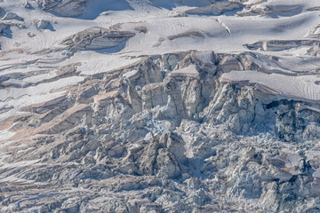 Impressive view of majestic glacier with crevices and various textures in mountainous region