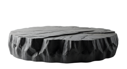A rough, textured, dark gray stone podium or platform, isolated on a transparent background, with a rugged, uneven surface and carved, geometric sides, suitable for product display or conceptual image
