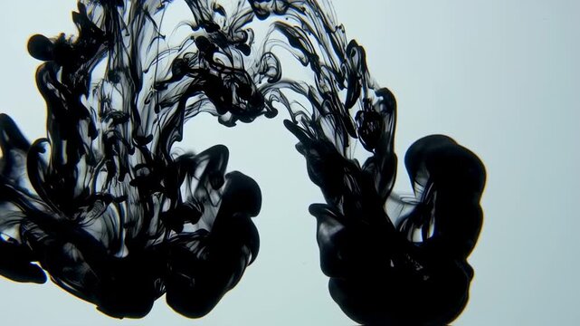 Black ink diffusing in liquid