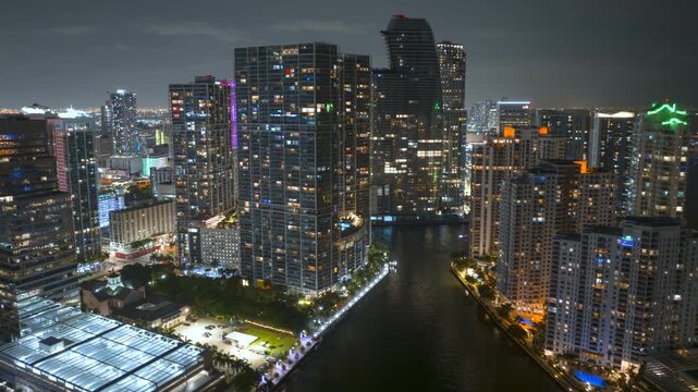 Urban night landscape of downtown district of Miami Brickell in Florida, USA. Skyline with brightly illuminated high skyscraper buildings in modern American megapolis
