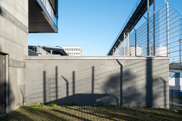 Urban background in Stockholm with modern wall and shadows creating geometric lines, contemporary architecture providing copy space ideal for text, templates and graphic design compositions