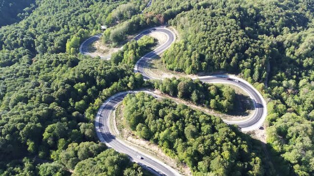 Aerial view of winding asphalt mountain road among green trees in summer. (Domani&ccedil;,İneg&ouml;l dağ yolu)	