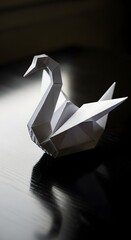 Origami swan on a reflective surface against a dark background, a symbol of elegance
