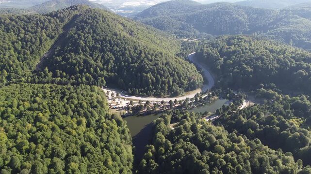 Aerial view of winding asphalt mountain road among green trees in summer. (Domani&ccedil;,İneg&ouml;l dağ yolu)	