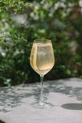 Glass of refreshing drink with a garnish outdoor
