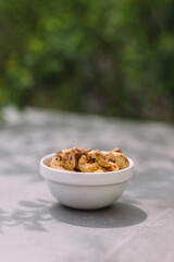 Snack bowl with roasted cashew nuts and spices