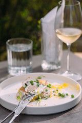 Enjoying a fresh meal with white wine outdoors