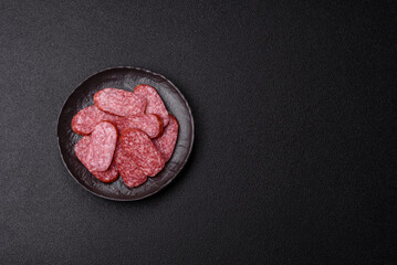 Sliced salami sausage, smoked meat as a delicacy for the table. Salami sausage