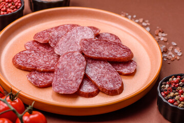 Sliced salami sausage, smoked meat as a delicacy for the table. Salami sausage