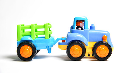 Colorful plastic toy tractor  children’s play and learning.