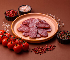 Sliced salami sausage, smoked meat as a delicacy for the table. Salami sausage