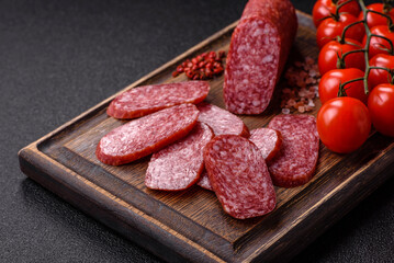 Sliced salami sausage, smoked meat as a delicacy for the table. Salami sausage