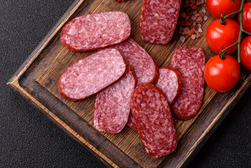 Sliced salami sausage, smoked meat as a delicacy for the table. Salami sausage