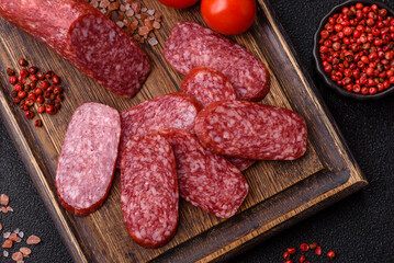 Sliced salami sausage, smoked meat as a delicacy for the table. Salami sausage
