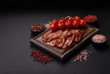 Fried pork bacon slices or strips as a breakfast ingredient. Fried bacon