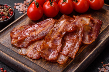 Fried pork bacon slices or strips as a breakfast ingredient. Fried bacon