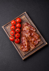 Fried pork bacon slices or strips as a breakfast ingredient. Fried bacon