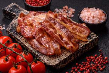 Fried pork bacon slices or strips as a breakfast ingredient. Fried bacon