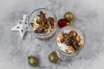Holiday dessert with whipped cream and festive decorations