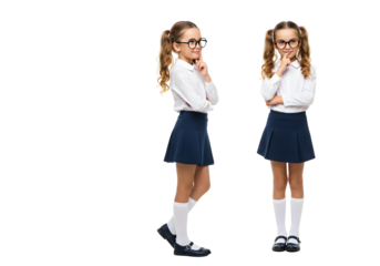 Two young girls in school uniforms thinking with fingers on their lips on a white background