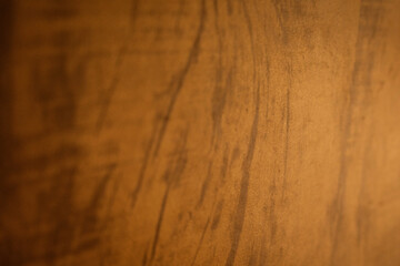 Dark and warm abstract wood grain texture with natural patterns for a background.