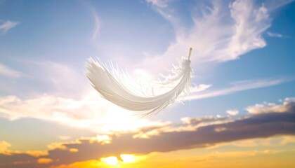 Feather floating in a vibrant sky at sunset