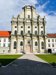 Grand Baroque church facade in Furstenfeldbruck, Germany with ornate columns and central entrance