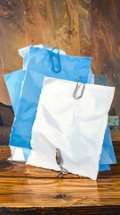 Stacked papers on a wooden surface