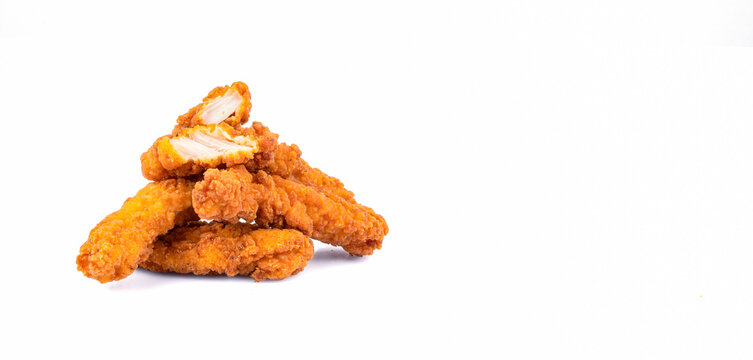 Fried chicken breast strips on white background. Isolated chicken crisps