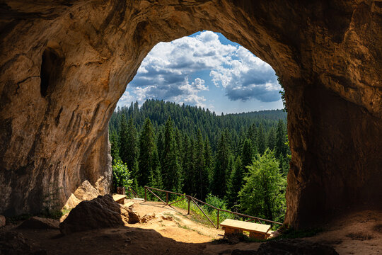 View from inside the Bijambare cave looking out towards the lush green forest, Bijambare Protected Landscape, Bosnia and Herzegovina, on a sunny summer day.