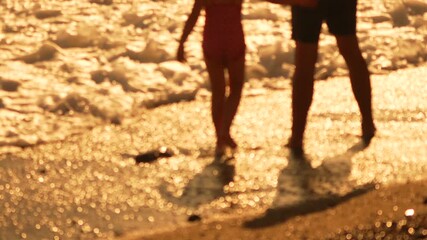 People Beach Water. Legs wading in golden sunlit ocean shallows at sunset for leisure. - Powered by Adobe