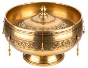 Intricately designed brass bowl with ornate engravings and decorative hanging elements, showcasing craftsmanship.