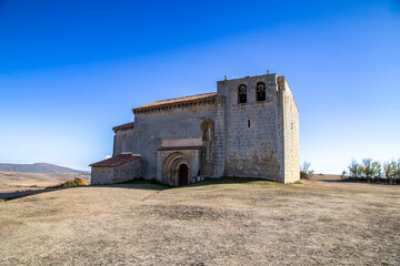 The monumental Romanesque Church of Saint Martin of Tours standing in a rural landscape in...