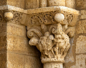 Intricate Romanesque capital with carved rams at the Church of San Martin de Tours, Fromista, Spain