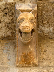 Romanesque stone corbel of a snarling monster at the Church of San Martin de Tours, Fromista, Spain
