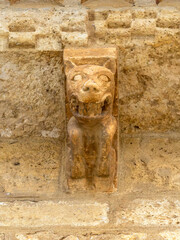 Romanesque stone corbel of a snarling monster at the Church of San Martin de Tours, Fromista, Spain