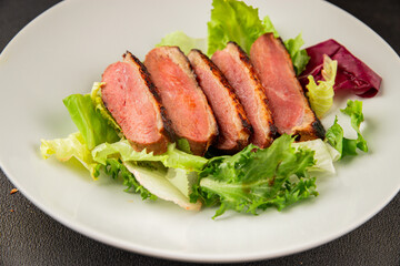 Duck breast roast poultry fresh natural product tasty snack delicious gourmet food background on the table rustic top view copy space