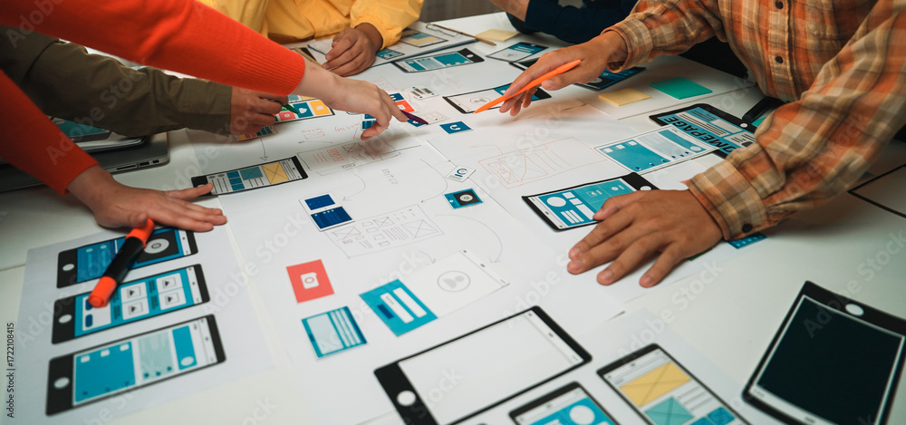 Poster a group of professionals engages in a collaborative effort to design wireframes and user interfaces 