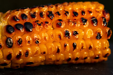 Fresh and delicious grilled sweet corn. Detail of tasty roasted corn