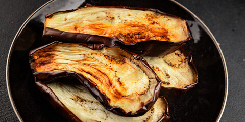 Baked eggplant grilled vegetables fresh natural product tasty snack delicious gourmet food background on the table rustic top view copy space keto and paleo diet vegan and vegan food