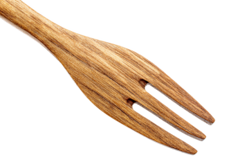 Eco-friendly wooden fork tines macro, isolated on white transparent background