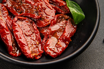 Sun-dried tomatoes snack vegetables natural product tasty snack fresh delicious gourmet food background on the table rustic top view copy space keto and paleo diet vegan and vegan food