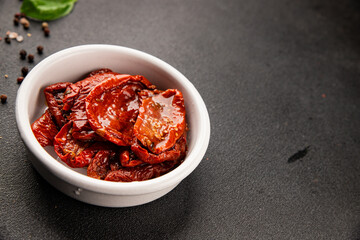 Sun-dried tomatoes snack vegetables natural product tasty snack fresh delicious gourmet food background on the table rustic top view copy space keto and paleo diet vegan and vegan food