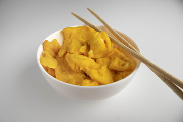 simple scrambled eggs on a plate on a white background