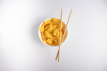 simple scrambled eggs on a plate on a white background