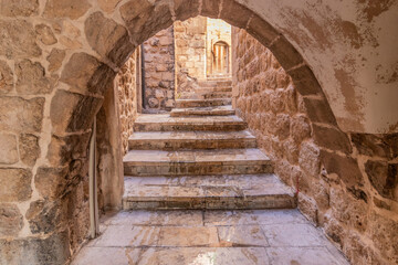 Narrow steep alley in Mardin, Turkey