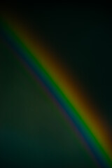 Dark background with rainbow arc for creative projects