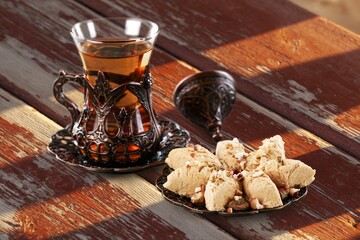 Traditional plate with sweet date fruits and tea