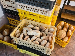 Food commerce and everyday shopping. Sale of bread with a close-up view of bakery products on shelves in a store or bakery.